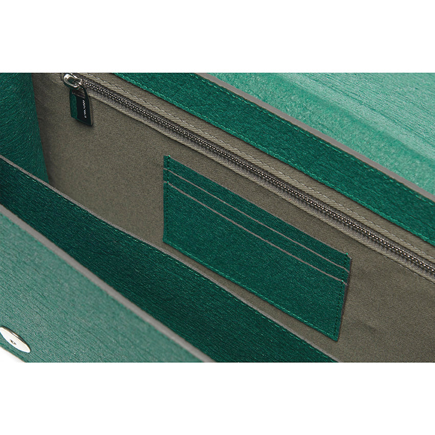 The Cristiana Vegan Shoulder Bag by Studio Tondini. Interior view of the forest green version, revealing structured compartments lined in cotton and Piñatex® - refined, functional, and consciously crafted.