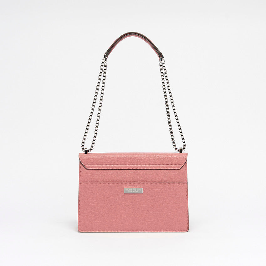 The Cristiana Vegan Shoulder Bag by Studio Tondini. Back view of the antique pink version, showcasing clean architectural lines, a rear pocket, and the discreet branded plate.