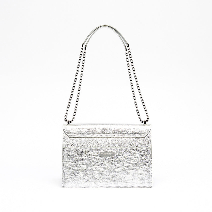 The Cristiana Vegan Shoulder Bag by Studio Tondini. Back view of the silver version, showcasing clean architectural lines, a rear pocket, and the discreet branded plate.