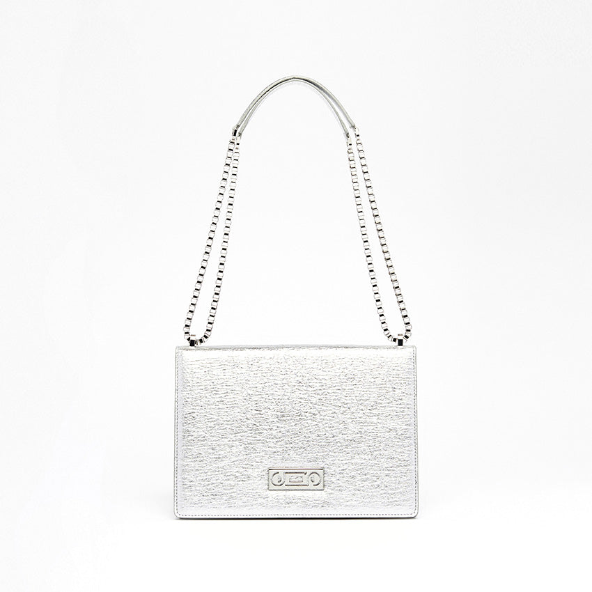 Front view of The Cristiana Vegan Shoulder Bag in silver Piñatex with composed silhouette and architectural proportions crafted in Italy.