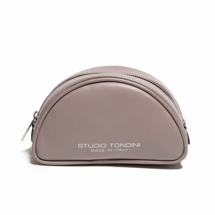 Front view of The Valentina Toiletry in Light Grey leather featuring compact proportions, curved silhouette, and refined Italian craftsmanship.
